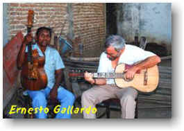 Two men with guitars. Caption: Ernesto Gallardo