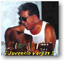 Man with a guitar. Caption: Junencio Vargas!